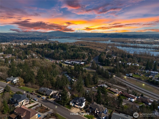 bird's eye view featuring a water and mountain view