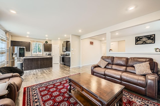 living room with light hardwood / wood-style floors