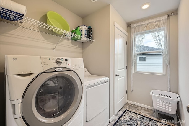 washroom featuring washer and clothes dryer