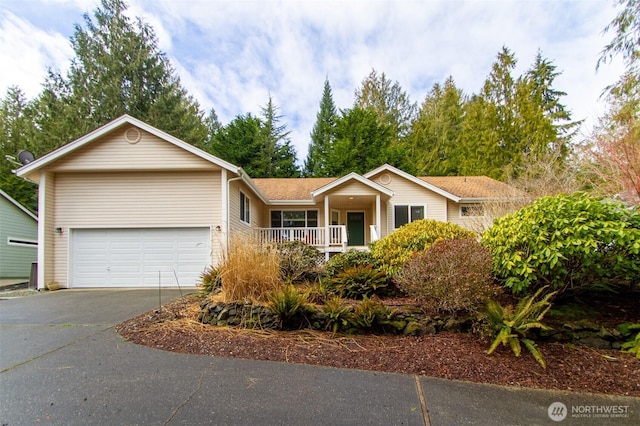 single story home featuring a garage and driveway