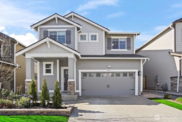 craftsman-style home featuring a garage and concrete driveway