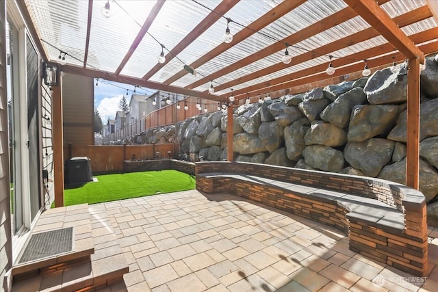 view of patio with fence and a pergola