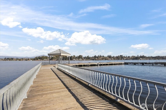 view of dock with a water view and a gazebo