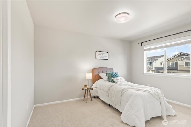 bedroom with carpet and baseboards