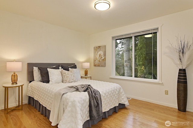 bedroom with light hardwood / wood-style flooring