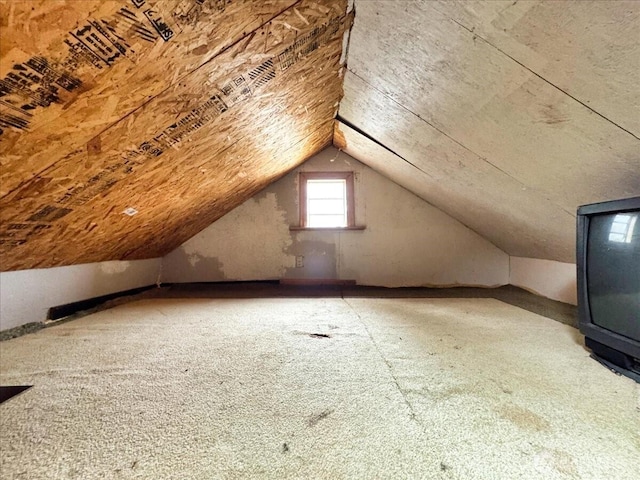 bonus room featuring vaulted ceiling