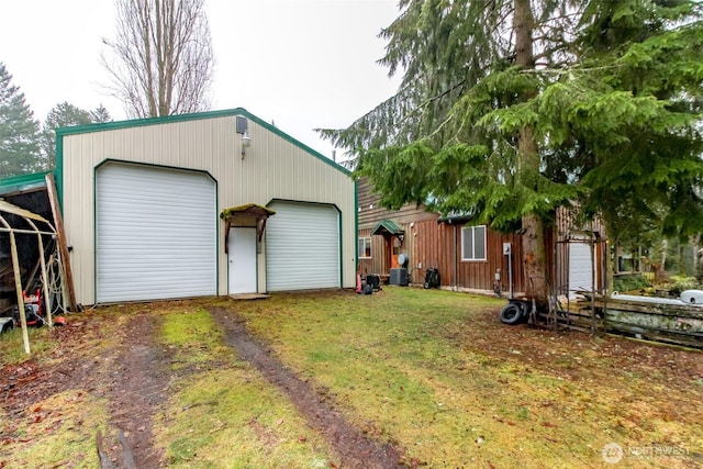 detached garage featuring central air condition unit