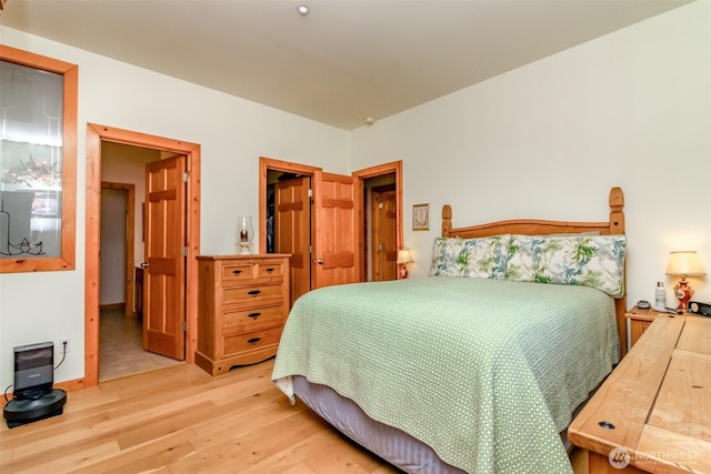 bedroom with wood finished floors