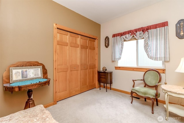 sitting room with carpet flooring and baseboards