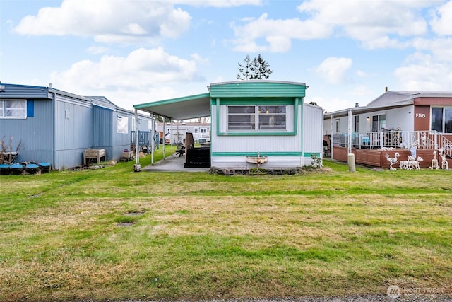 back of house featuring a lawn