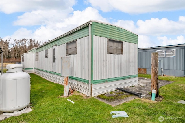 view of property exterior with a yard