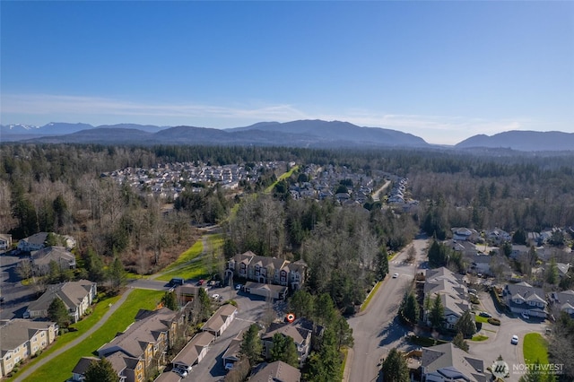 bird's eye view featuring a mountain view and a view of trees