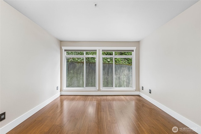 unfurnished room featuring hardwood / wood-style floors