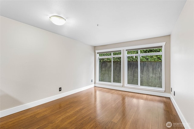 empty room featuring hardwood / wood-style floors