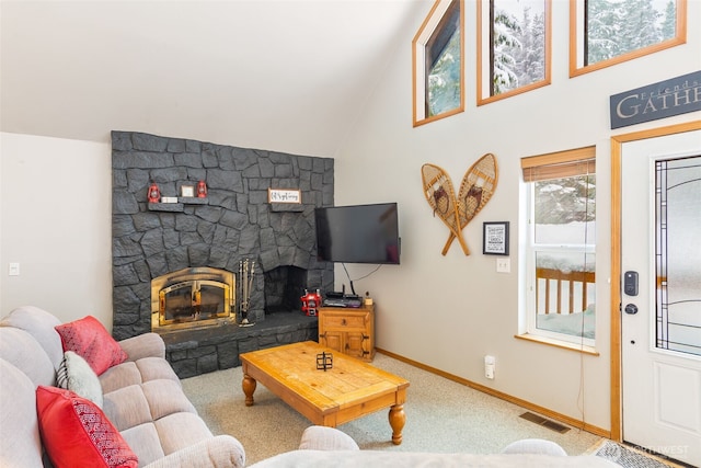 living room featuring high vaulted ceiling, a stone fireplace, visible vents, baseboards, and carpet