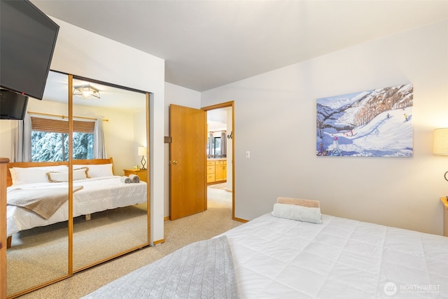 bedroom featuring a closet and light colored carpet