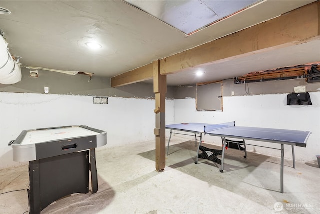 playroom with unfinished concrete flooring