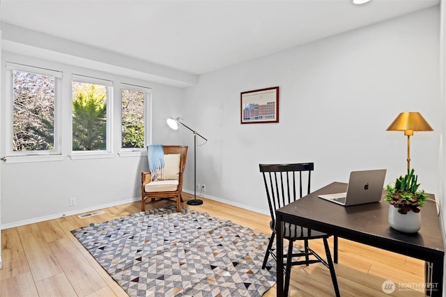 office with hardwood / wood-style flooring