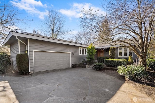 ranch-style house featuring a garage