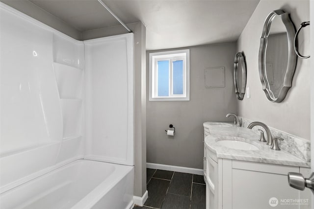 bathroom with vanity, bathing tub / shower combination, and tile patterned flooring