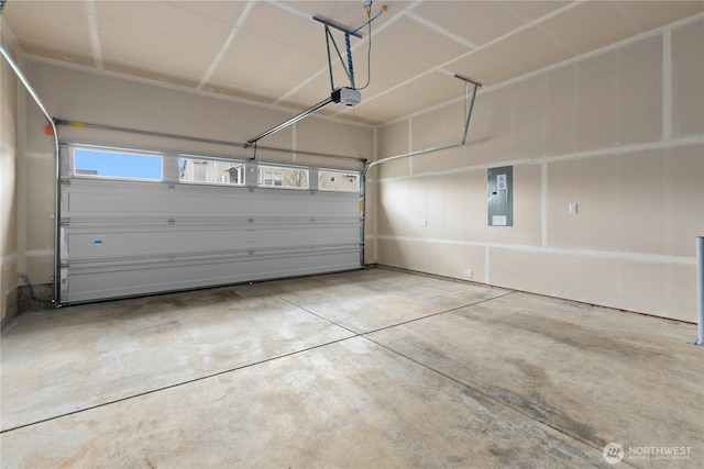 garage featuring a garage door opener and electric panel