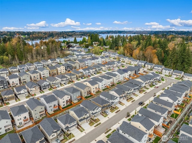 aerial view featuring a water view and a residential view