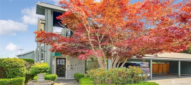 obstructed view of property with covered parking