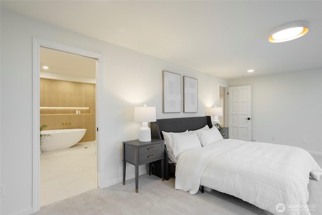 carpeted bedroom featuring connected bathroom