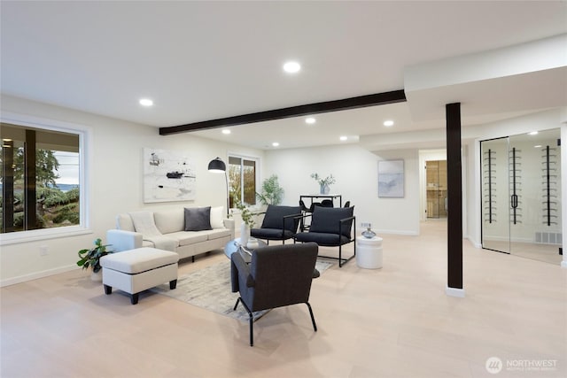 living room featuring beamed ceiling