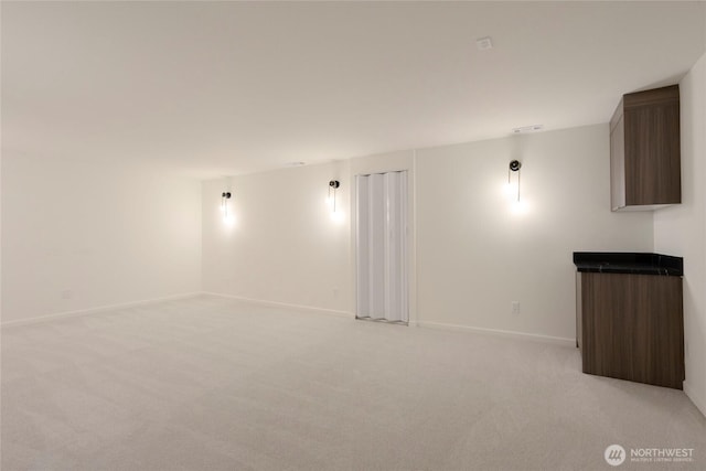 spare room with light colored carpet