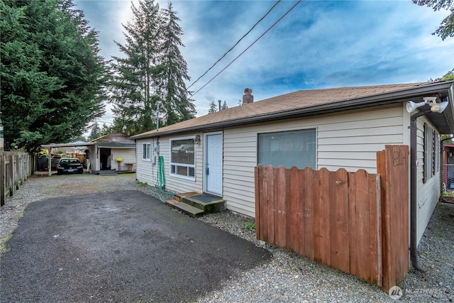 view of front of home featuring a carport