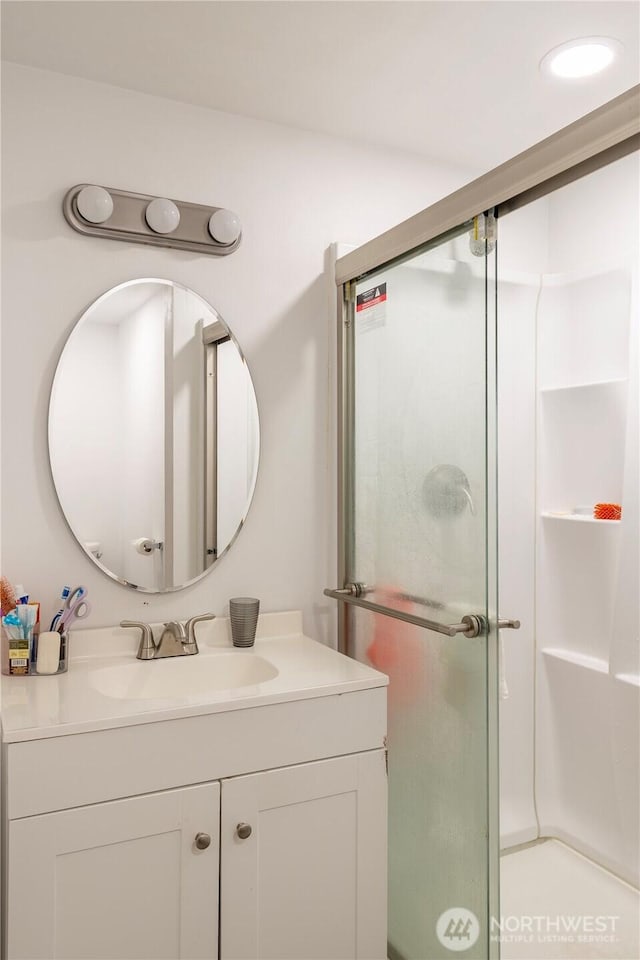 bathroom with vanity and walk in shower