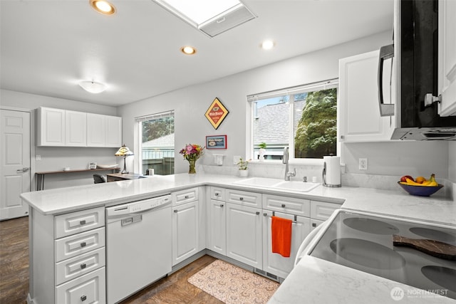 kitchen featuring sink, white cabinets, and dishwasher