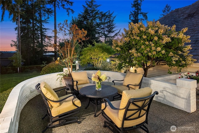 view of patio terrace at dusk