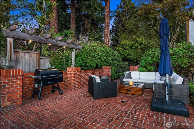 view of patio featuring area for grilling, fence, an outdoor living space, and a pergola