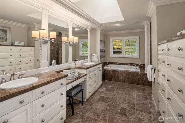 bathroom featuring ornamental molding, a garden tub, vanity, and a shower stall