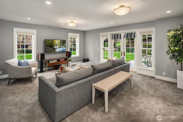 carpeted living area with recessed lighting, french doors, visible vents, and baseboards