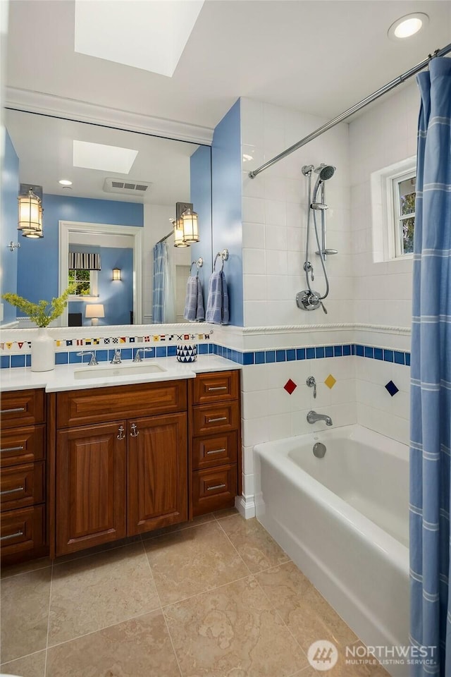 full bath featuring tile patterned flooring, shower / tub combo, vanity, visible vents, and decorative backsplash