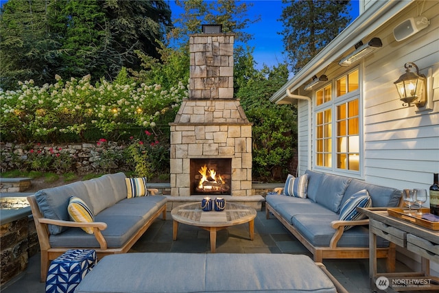 view of patio featuring an outdoor living space with a fireplace