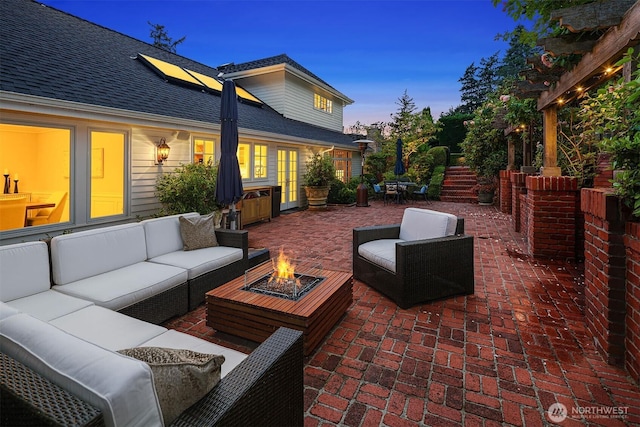 8826 NE 2nd Pl, Medina, WA 98039 - patio terrace at dusk with an outdoor living space with a fire pit and a patio