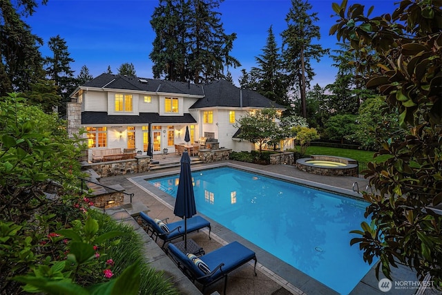 8826 NE 2nd Pl, Medina, WA 98039 - outdoor pool with a jacuzzi, a patio area, and an outdoor kitchen