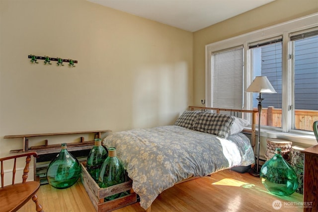 bedroom with wood finished floors