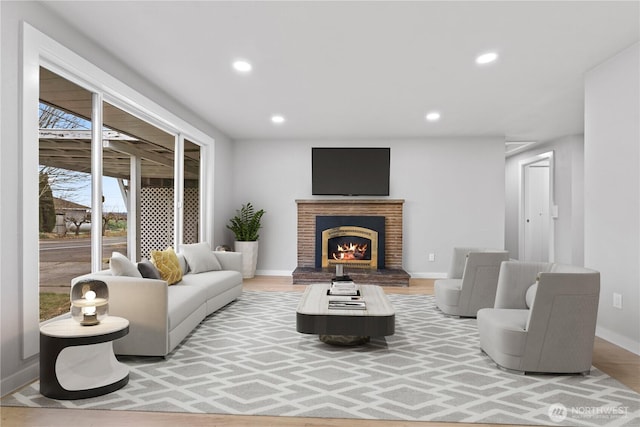 living room featuring a fireplace and hardwood / wood-style floors