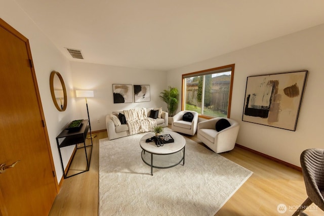 living room with light hardwood / wood-style floors