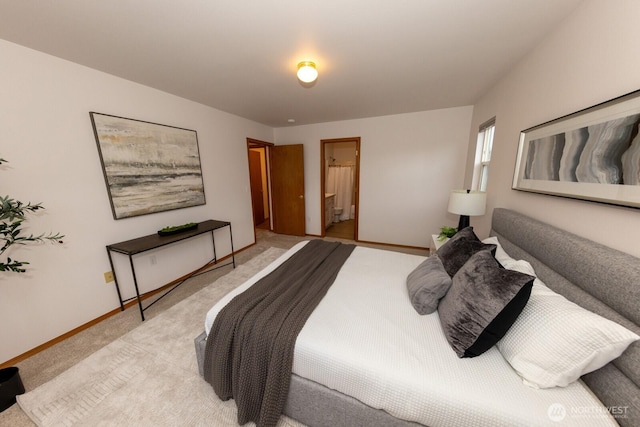 carpeted bedroom with ensuite bathroom