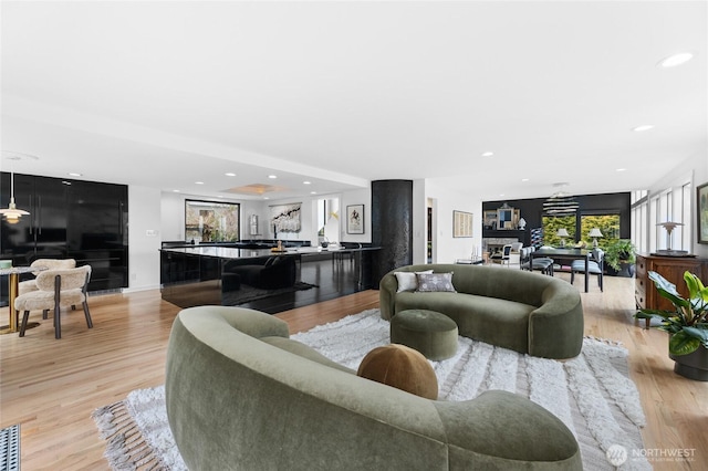 living room with light hardwood / wood-style flooring