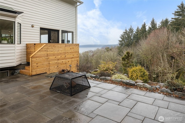 view of patio with a water view