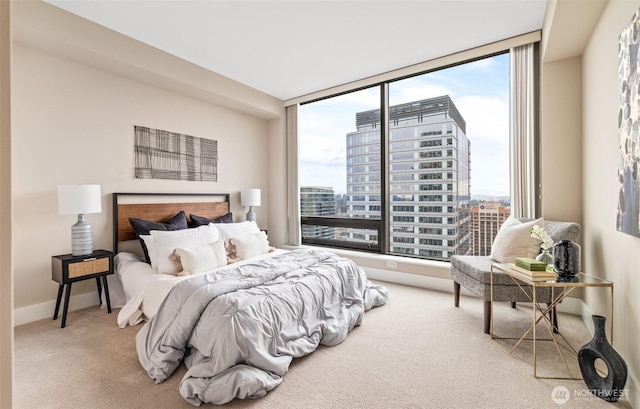 carpeted bedroom featuring multiple windows