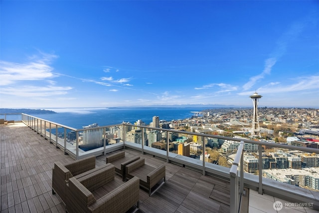 wooden deck featuring a view of city and a water view