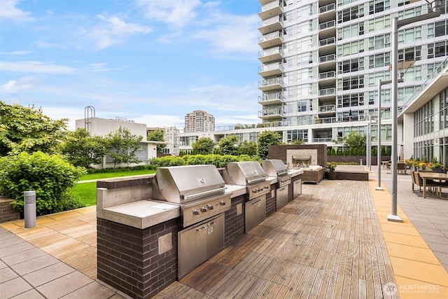 view of patio with a city view, grilling area, and area for grilling